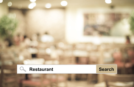Word Restaurant written on search bar over blur restaurant background, web banner, restaurant reservation, food online, food delivery conceptの写真素材