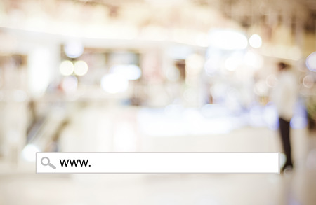 Word www. written on search bar over blur store background, web banner, online shopping background, business, E-commerceの写真素材