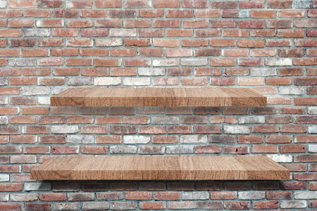 Empty wooden shelves over grunge brick wall, product display montage, template, backgroundの写真素材