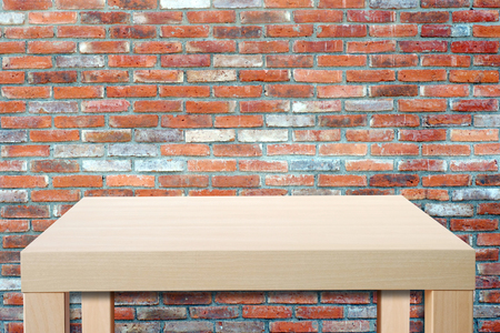 Empty wooden table over grunge brick wall, vintage, background, template, product display montageの写真素材