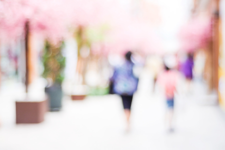 Blur people walking at market with bokeh light backgroundの写真素材