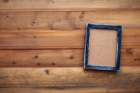 Blank black wooden frame on vintage wood background, templateの写真素材