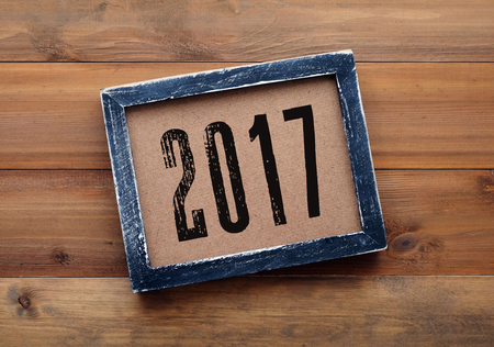 2017 on black vintage wooden frame background, new year concept, flate lay, top view