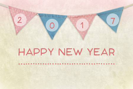 2017 on party flags and happy new year on cement wall background