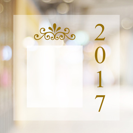 Happy New Year 2017 year on abstract blur festive bokeh background with copy space for text