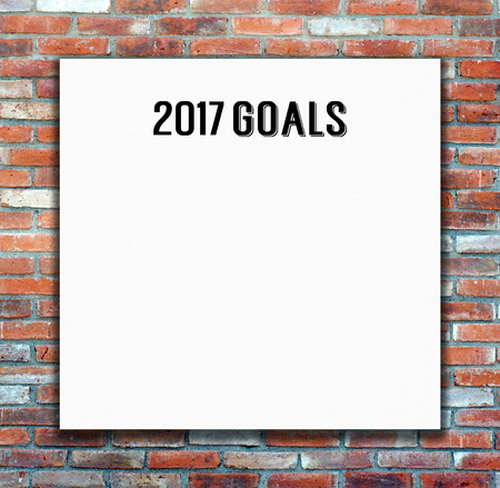 2017 goals on blank white poster on brick wall, business background with copy space for text ,new...