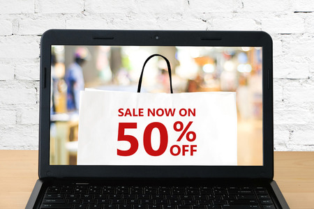 Online sale on labtop screen background, digital marketing, business and technologyの写真素材