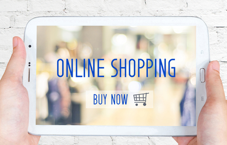 Hand holding tablet with on line shoping concept on screen, digital marketing, business technologyの写真素材