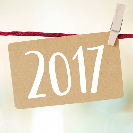 2017 card hanging over blur abstract background, new year conceptの写真素材