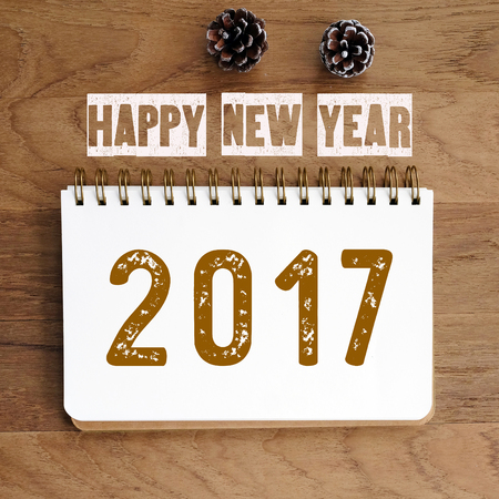 Happy new year 2017 on wood table background, banner, sign and symbolの写真素材