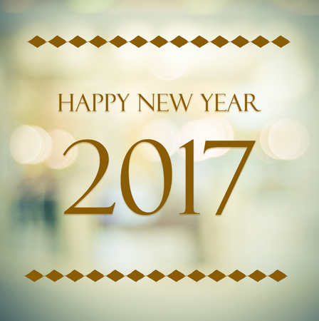 Happy New Year 2017 on abstract blur festive bokeh background, banner