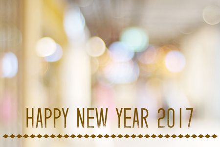Happy New Year 2017 year on abstract blur festive bokeh background, banner, new year card
