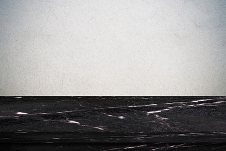 Empty black marble table over gray cement wall background, product display montageの写真素材