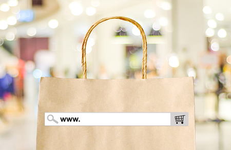 Word www. on search bar over shopping bag and blur store background, online shopping background, business, E-commerce, web bannerの写真素材