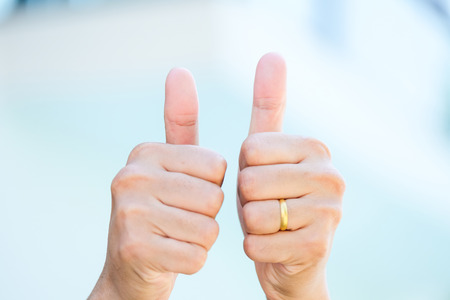 Man hand thumbs up gesture, close upの写真素材
