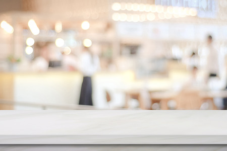 Empty white marble over blur cafe background, product and food display montageの写真素材
