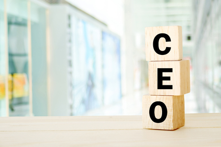 CEO, Chief Executive Officer, business word on wooden cube over blur office background, banner, with copy spaceの写真素材