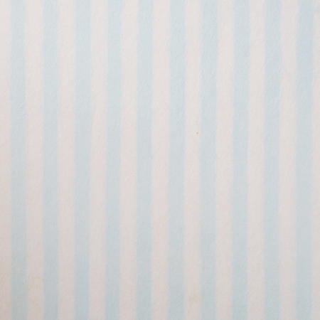 Blue and white striped pattern on mulberry paper textured background, detail close-upの写真素材