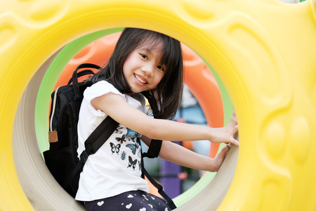 Cute asian girl, preschool, playing at playground, kid education and creation conceptの写真素材