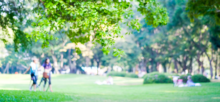 Blurred background of people activities in park with bokeh, spring and summer seasonの写真素材