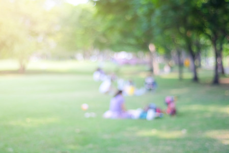 Blurred nature background, blur people activities in park with bokeh light background, spring and summerの写真素材