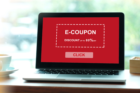 E-coupon, discount coupon on laptop screen to get the shopping on line promotion, on line shopping, digital marketing, business and technology, lifestyle concept の写真素材