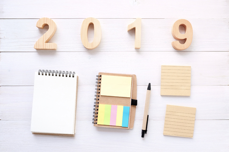 2019 wood letters, blank notebook paper on white table background, 2019 new year mock up, template...