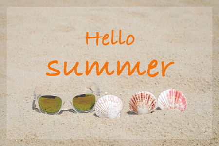 Hello summer on beach sand with sunglasses and seashell background, summer holiday vacation bannerの写真素材