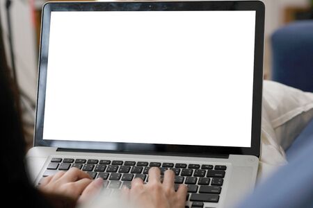 Woman hands typing laptop computer with blank screen for mock up template background, Laptop with...