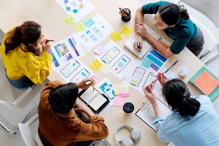 Brainstorm planing creative asian teamwork,  Group of asia mobile phone app developer team meeting...