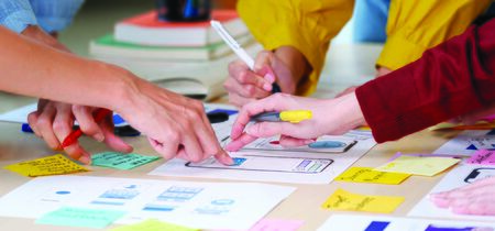 Brainstorm planing creative asian teamwork,  Close up of hands mobile phone app developer team...