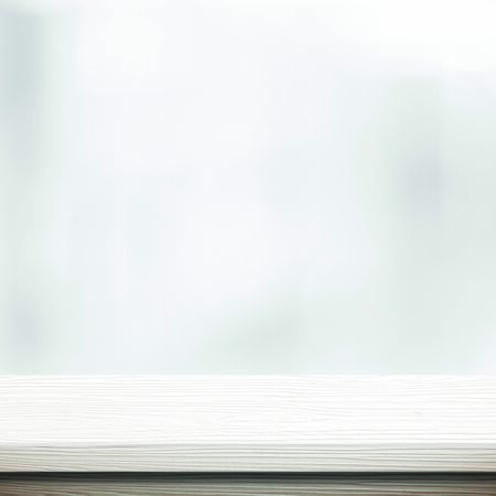 White table presentation, desk and blur background, Empty wood counter, shelf surface over blur restaurant white bokeh background, Wood table top for retail shop, store product display banner, mock upの写真素材