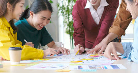 Brainstorm planing creative asian teamwork, Group of asia mobile phone app developer team meeting...