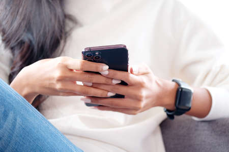 Close up of woman hand using mobile phone, People on smartphone, technology lifestyle, e commerce, online business, e learning, education, internet of things conceptの写真素材