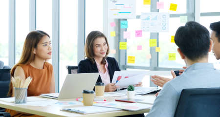 Young asian creative design meeting brainstorm ideas to plan and develop project together in office,...