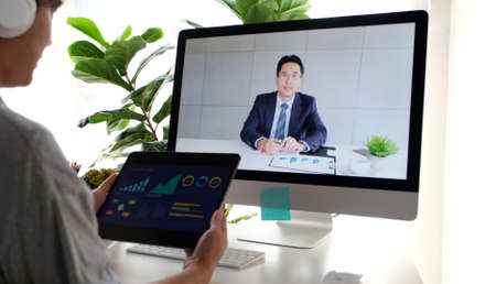 Video conference, Work from home, Asian man making video call to business team with virtual web...
