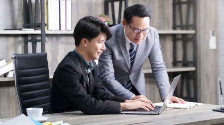 Asian businessmen discussing about business plan, Asia male team analyze business data at officeの写真素材