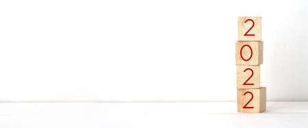 2022 on wood cube block over white background with copy space for text, Happy new year 2022 greeting...