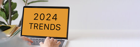 2024 trends on laptop computer screen background, business plan and technology concept