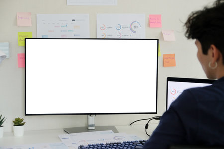 Man using desktop computer with blank screen for mock up template background, people business technology and lifestyle background conceptの写真素材
