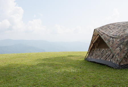 Tent camping on green grassの写真素材