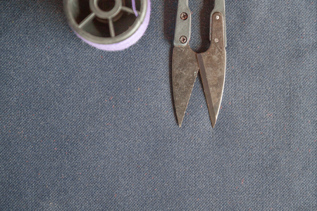 violet thread with metal scissor
