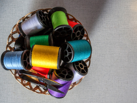color thread on little plastic basket