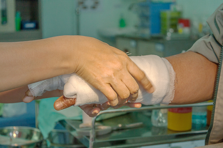 Dressing burned wound hand with gauze padの写真素材