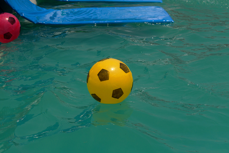 inflatable ball in outdoor water pool
