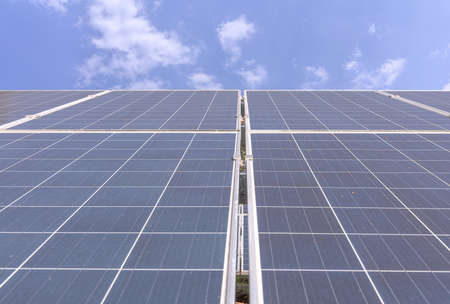 Blue solar panels during a cloudy dayの写真素材