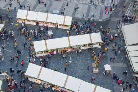 A view from above of the city square with a lot of walking people. Trade pavilions with food and souvenirsのeditorial素材