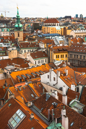 Panorama of the city of Prague. The old part of the city. Beautiful roofs of shingles. Ancient buildings and churches.の写真素材