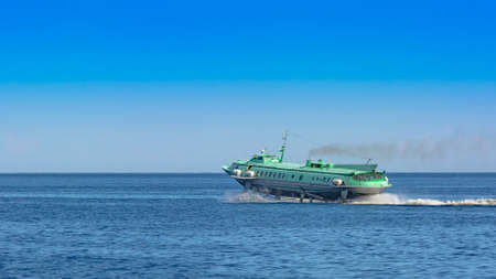 Hydrofoil meteor or comet on Lake Onega. View from the window of a moving ship in the trail on the...