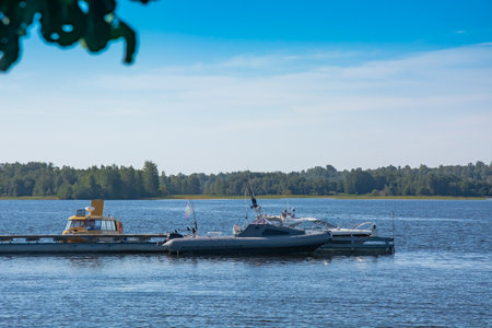 Historical, architectural and ethnographic open-air museum-reserve Kizhi. A view from afar on a wooden church, a bell tower on an island in Lake Onega. On the left is a wooden house with a haystack.のeditorial素材